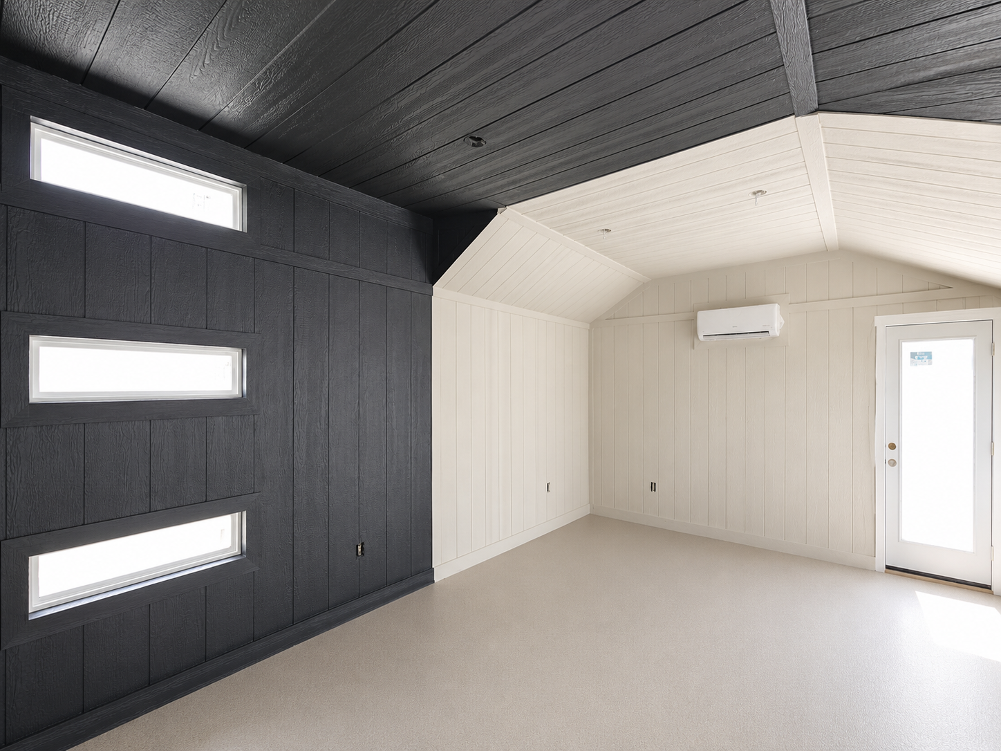 Modern interior with black paneled wall, white ceiling, and a door.